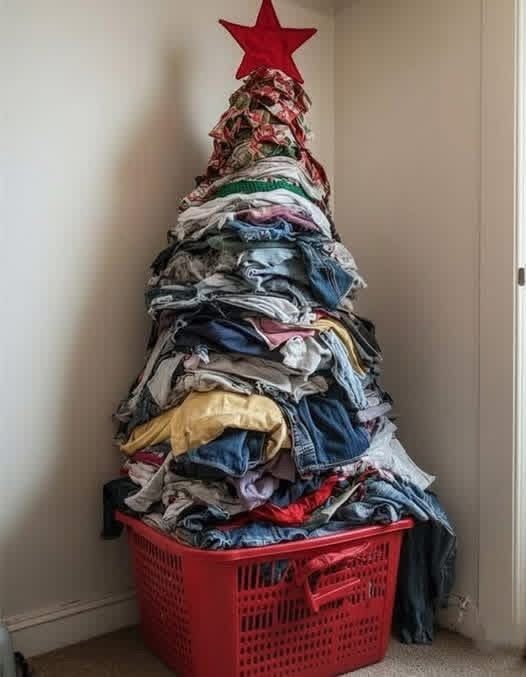Pile of laundry stacked like a Christmas tree with a star on top, representing the need for holiday laundry pickup and delivery service