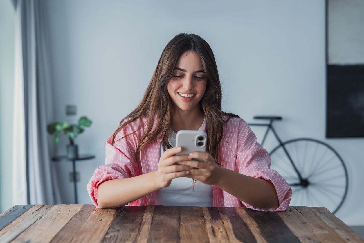 Woman Smiling at phone