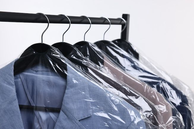 Dry cleaned clothes on a rack
